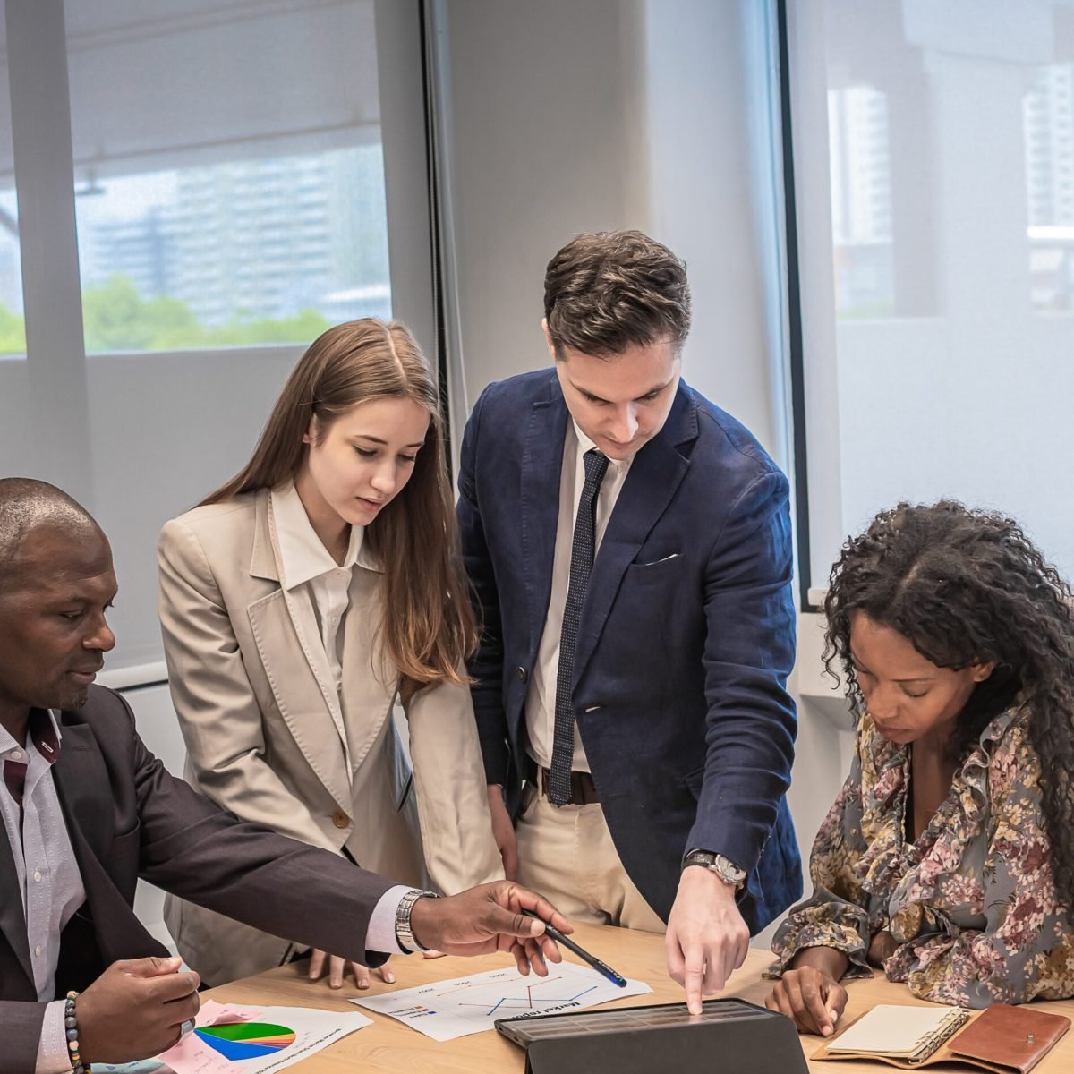 Business people meeting and look tablet for discuss with project Business people meeting and look tablet for discuss with project in modern office.